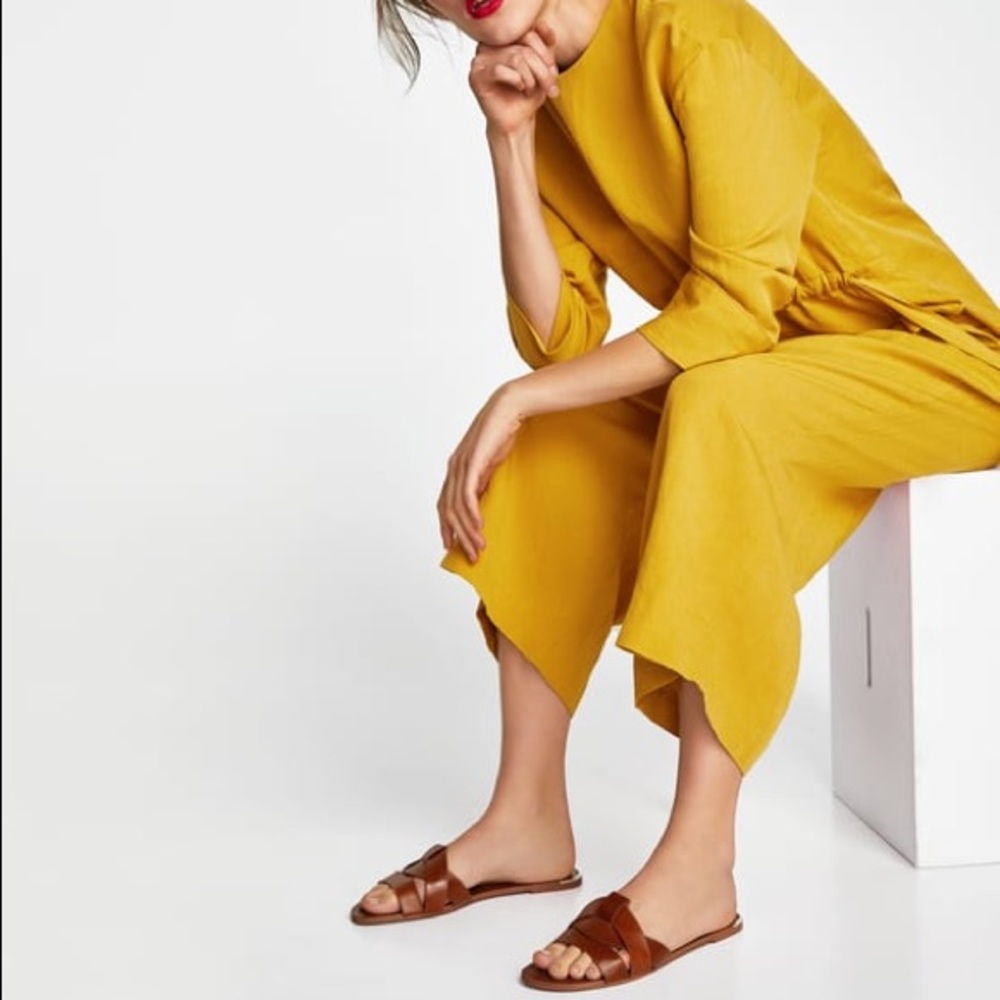 Brown leather crossover sandals